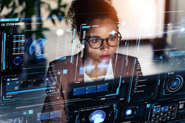 Black woman working in office and futuristic graphical user inte